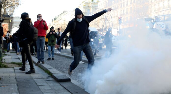 Paris police fire tear gas at protesters